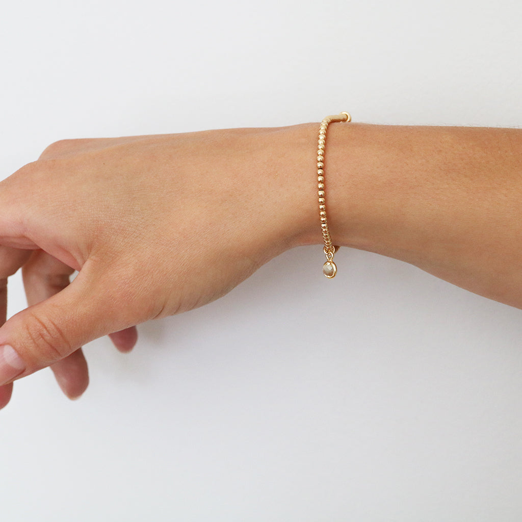 Charmed with Compassion Bracelet | Emerald and Gold