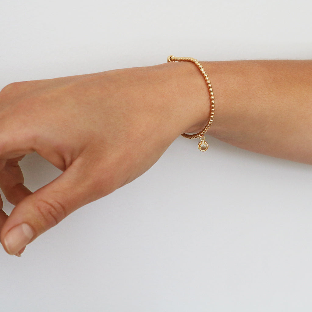 Charmed with Compassion Bracelet | Emerald and Gold