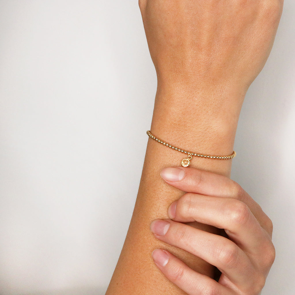 Charmed with Compassion Bracelet | Emerald and Gold