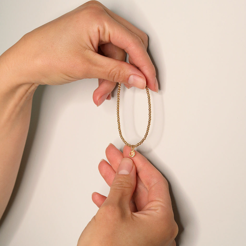 Charmed with Compassion Bracelet | Emerald and Gold